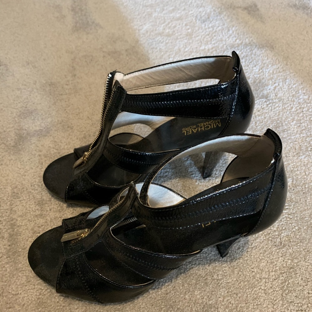 Black woman’s Michael kors platform shoes